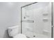 Modern bathroom with sliding glass shower door and white tile surround at 25536 W Primrose Ln, Buckeye, AZ 85326