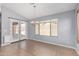 Dining room boasts tile floors, modern chandelier, and glass doors to outdoor patio at 25536 W Primrose Ln, Buckeye, AZ 85326