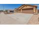 Inviting single-Gathering home with a two-car garage, desert landscaping, and a brick-paved walkway at 25536 W Primrose Ln, Buckeye, AZ 85326
