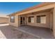 Covered patio with ceiling fan and access to landscaped yard at 25536 W Primrose Ln, Buckeye, AZ 85326