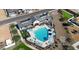 Overhead view of a community pool and play area with mature desert landscaping at 2672 E Bluff Spring Ave, Apache Junction, AZ 85119