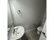 Modern half bathroom with a gray tiled floor, a pedestal sink and a stylish mirror at 2672 E Bluff Spring Ave, Apache Junction, AZ 85119