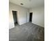 Cozy bedroom featuring plush gray carpets, a walk-in closet and ample natural light at 2672 E Bluff Spring Ave, Apache Junction, AZ 85119
