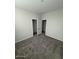 Neutral bedroom with plush gray carpeting, a walk-in closet and an en-suite bathroom at 2672 E Bluff Spring Ave, Apache Junction, AZ 85119