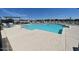 Community pool with ample lounge chairs and umbrellas for residents at 2672 E Bluff Spring Ave, Apache Junction, AZ 85119