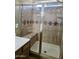 Bathroom showcasing a shower with tile surround, bench, and built in shelving at 28202 N Willemite Dr, San Tan Valley, AZ 85143