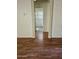 A short hallway leads to a bathroom with a window providing natural light at 28202 N Willemite Dr, San Tan Valley, AZ 85143