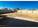 Large, flat backyard with block fence offers privacy and potential for customization at 3338 W Palmaire Ave, Phoenix, AZ 85051