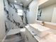 Modern bathroom features marble-like tile, sleek fixtures, and a contemporary vessel sink at 3338 W Palmaire Ave, Phoenix, AZ 85051