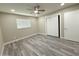 This bedroom boasts light-colored walls, gray toned wood flooring, and a closet at 3338 W Palmaire Ave, Phoenix, AZ 85051