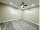 Bright bedroom with wood-look flooring, recessed lighting, and neutral wall color at 3338 W Palmaire Ave, Phoenix, AZ 85051