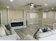 Bright living room with a modern fireplace and light gray toned wood flooring at 3338 W Palmaire Ave, Phoenix, AZ 85051