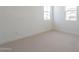 Bright bedroom featuring neutral tones, two windows, and base moulding for modern comfort at 3483 W Sunstone Dr, San Tan Valley, AZ 85144