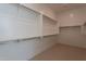 Spacious walk-in closet featuring ample shelving and hanging space for optimal organization and convenience at 3483 W Sunstone Dr, San Tan Valley, AZ 85144