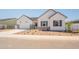 Charming single-Gathering home featuring a two-car garage, tasteful stone accents, and attractive landscaping at 3483 W Sunstone Dr, San Tan Valley, AZ 85144