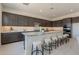 Spacious kitchen with a large island, ample cabinetry, and stainless steel appliances at 3483 W Sunstone Dr, San Tan Valley, AZ 85144