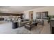 Open-concept living room with kitchen and dining views, neutral tones, and stylish decor at 3483 W Sunstone Dr, San Tan Valley, AZ 85144