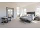 Serene bedroom with plush carpet, neutral colors, and a stylish sitting area at 3483 W Sunstone Dr, San Tan Valley, AZ 85144