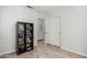 Bedroom with hardwood floors, closet, modern decor, and a shelf with books at 3514 W Sands Dr, Glendale, AZ 85310