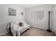 Bright bedroom with hardwood floors, modern decor, light, and a comfy sofa at 3514 W Sands Dr, Glendale, AZ 85310