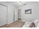 Bright bedroom with hardwood floors, closet, modern decor, and a ceiling fan at 3514 W Sands Dr, Glendale, AZ 85310