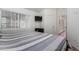 Bedroom featuring an exterior view and a wall-mounted television at 3514 W Sands Dr, Glendale, AZ 85310