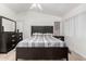 Neutral bedroom featuring matching dark wood furniture and a window at 3514 W Sands Dr, Glendale, AZ 85310