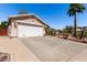 Exterior view of a single-story home featuring a well-maintained front yard with desert landscaping at 3514 W Sands Dr, Glendale, AZ 85310