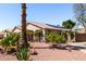 Exterior view of property showing desert landscaping, solar panels, and neighborhood at 3514 W Sands Dr, Glendale, AZ 85310