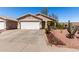 Charming single-story home featuring a well-maintained front yard with desert landscaping at 3514 W Sands Dr, Glendale, AZ 85310