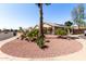 Exterior view of property showing desert landscaping, solar panels, and neighborhood at 3514 W Sands Dr, Glendale, AZ 85310