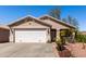 Inviting single-story home featuring a manicured front yard with desert landscaping at 3514 W Sands Dr, Glendale, AZ 85310