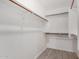 Spacious walk-in closet with hardwood floors, rods, and shelving creating an organized wardrobe area at 3514 W Sands Dr, Glendale, AZ 85310