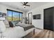 Comfortable bedroom with a large window offering scenic views, a TV, and a private bathroom at 36004 N Prickley Pear Rd, Cave Creek, AZ 85331