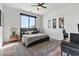 Serene bedroom with a neutral color scheme, stylish artwork, and a dedicated workspace at 36004 N Prickley Pear Rd, Cave Creek, AZ 85331