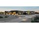 Modern desert home with beautiful desert landscaping, walkway and ambient outdoor lighting at dusk at 36004 N Prickley Pear Rd, Cave Creek, AZ 85331