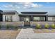 Contemporary home featuring desert landscaping and a gated entrance in a xeriscaped yard at 36004 N Prickley Pear Rd, Cave Creek, AZ 85331
