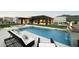 Stunning backyard with a pool, fire feature, and comfortable lounge chairs, perfect for relaxing and enjoying the outdoors at 36004 N Prickley Pear Rd, Cave Creek, AZ 85331