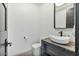 Stylish powder room featuring a modern vessel sink, sleek faucet, and neutral color palette, enhancing the home's contemporary appeal at 36004 N Prickley Pear Rd, Cave Creek, AZ 85331