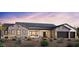 Beautiful single-story home featuring a stone facade, two-car garage, and desert landscaping at 4329 S Parkcrest St, Gilbert, AZ 85297