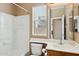 Bathroom featuring a vanity, toilet, shower over tub, and a window with blinds at 44390 W Buckhorn Trl, Maricopa, AZ 85138