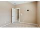 Bedroom featuring neutral walls, carpeted floor, and a doorway to another room at 44390 W Buckhorn Trl, Maricopa, AZ 85138