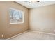 Cozy bedroom with neutral color palette, carpet, and natural light at 44390 W Buckhorn Trl, Maricopa, AZ 85138