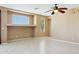 Neutral bedroom featuring tile flooring, a ceiling fan, and natural light at 44390 W Buckhorn Trl, Maricopa, AZ 85138