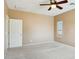 Neutral bedroom featuring a ceiling fan and carpet flooring at 44390 W Buckhorn Trl, Maricopa, AZ 85138
