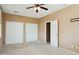 Bedroom featuring neutral walls, carpeted floor, and a double door closet at 44390 W Buckhorn Trl, Maricopa, AZ 85138
