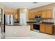 Well-equipped kitchen with stainless appliances and lots of counter space at 44390 W Buckhorn Trl, Maricopa, AZ 85138