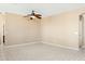 Spacious living room featuring neutral paint and tile flooring at 44390 W Buckhorn Trl, Maricopa, AZ 85138