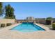 Fenced backyard pool with a large deck, perfect for relaxing and entertaining at 44390 W Buckhorn Trl, Maricopa, AZ 85138