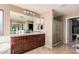 Spacious main bathroom with double vanity, soaking tub, and separate glass shower at 4725 N 152Nd Dr, Goodyear, AZ 85395